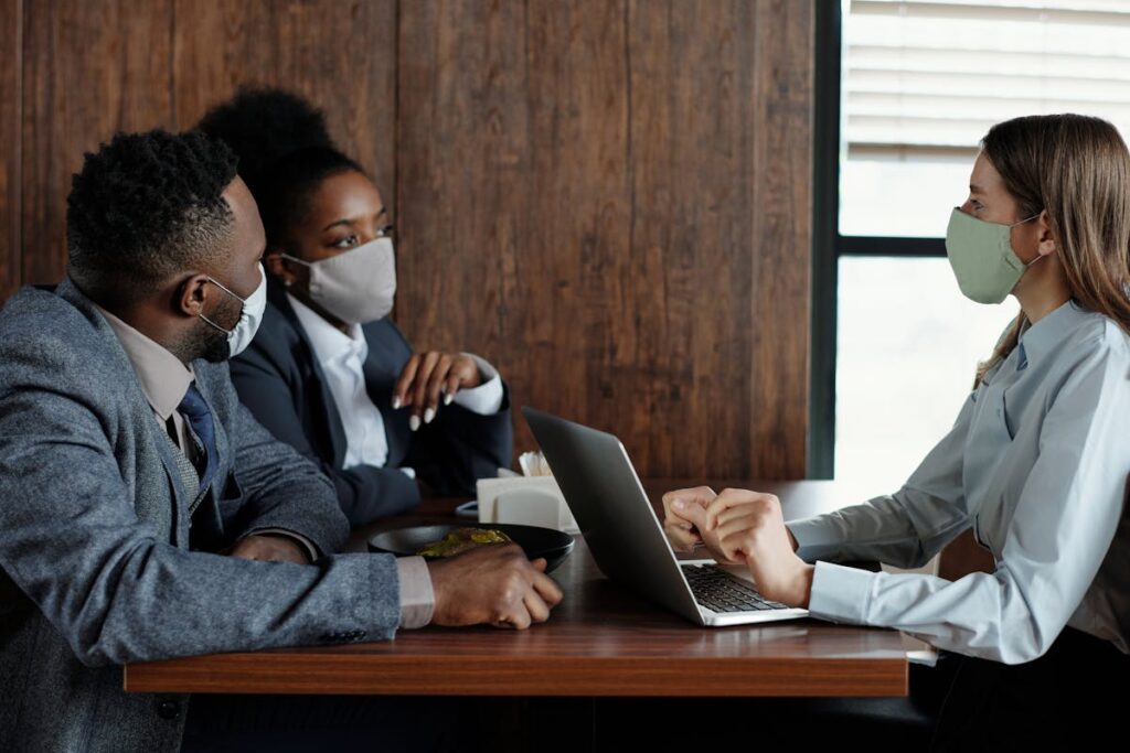 Business People Wearing Face Masks and Talking