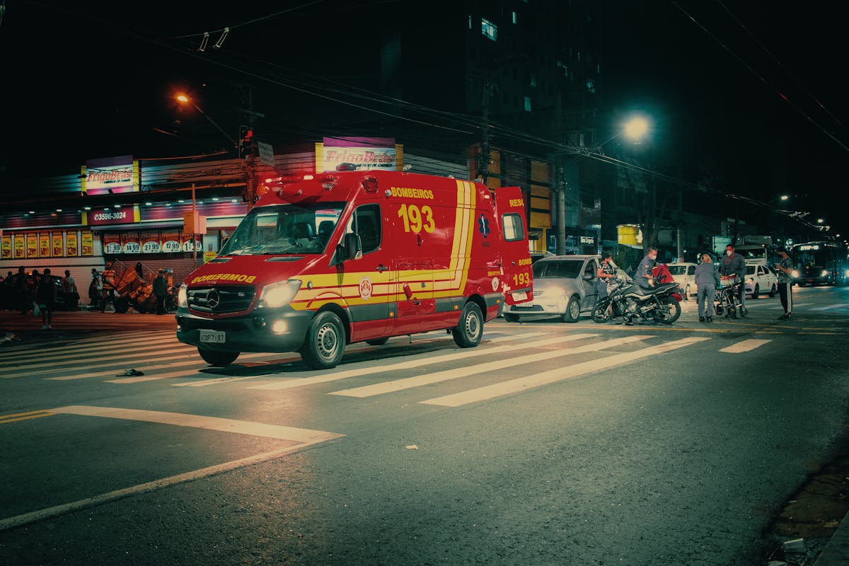 Ambulance car on city road at night