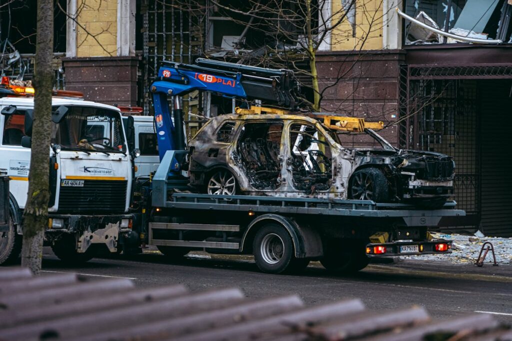 Burnt Car Scene in Kyiv Street After Conflict