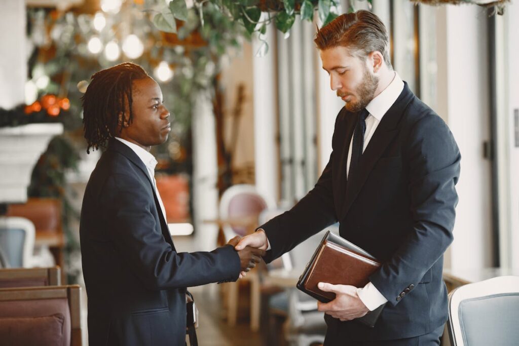 Men Wearing Corporate Attire Shaking Hands