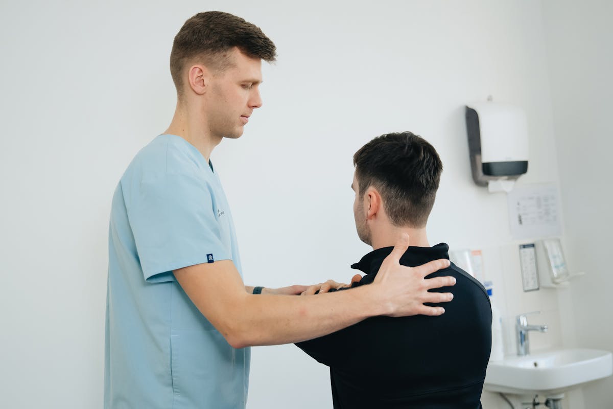 Physiotherapist Massaging Arm