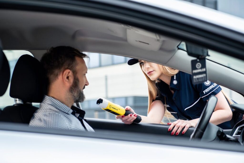 Police Officer Conducts Breathalyzer Test on Driver
