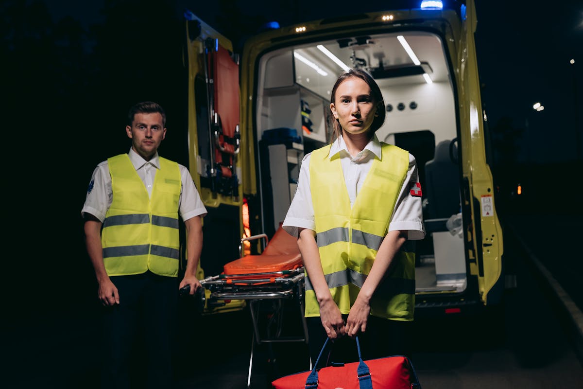 A Pair of Paramedics Wearing a Neon Vests