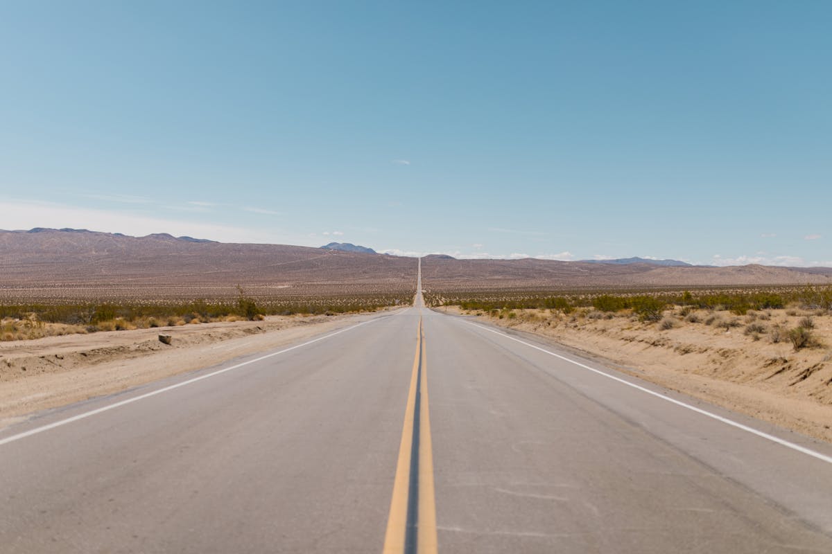 Gray Concrete Road Under Blue Sky