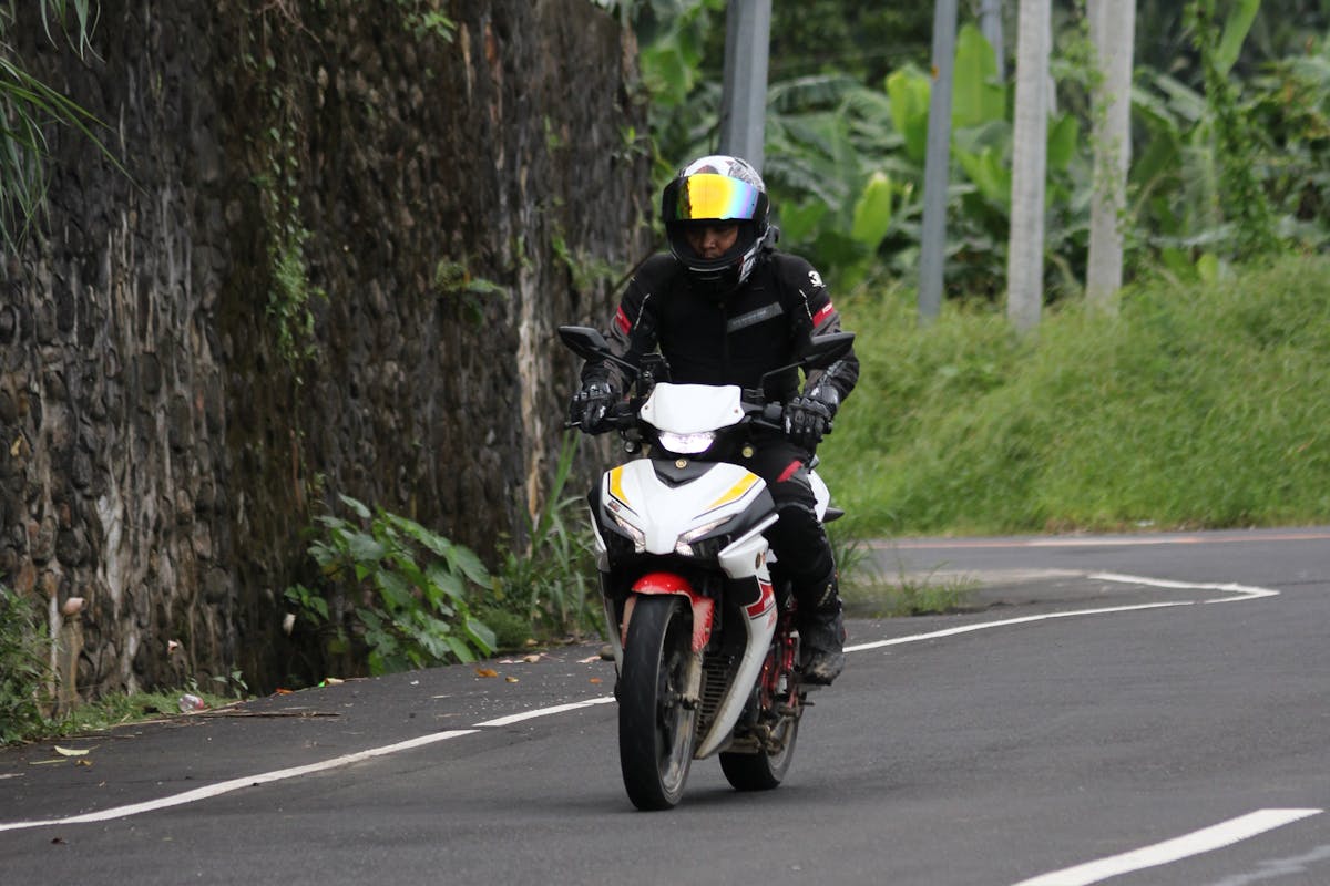 Motorcyclist Riding on Scenic Country Road