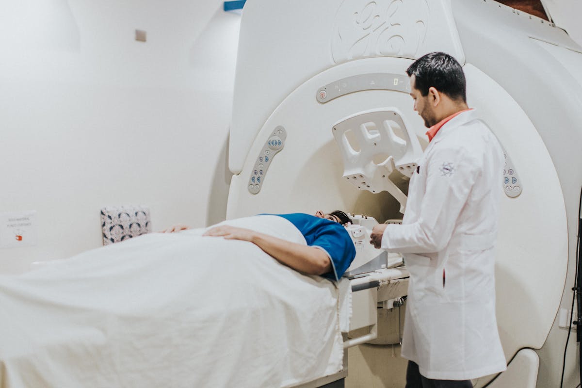 Doctors and patient during MRI scan in medical facility