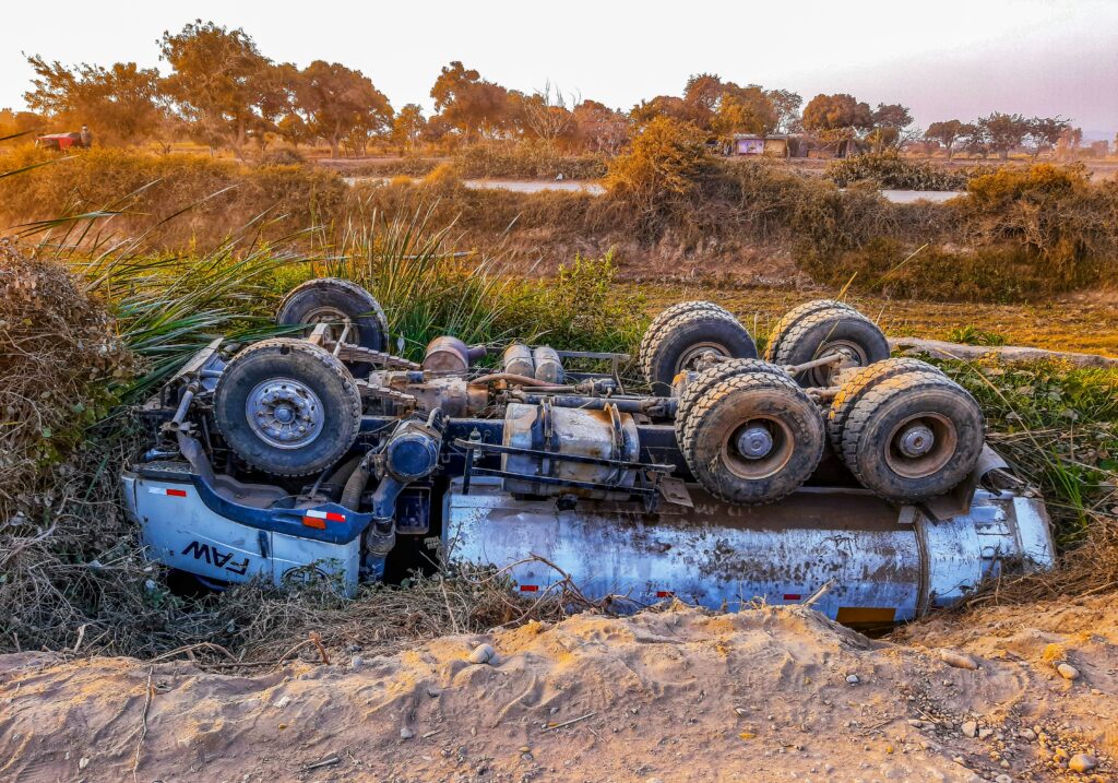 Wrecked Truck Upside Down On Roadside